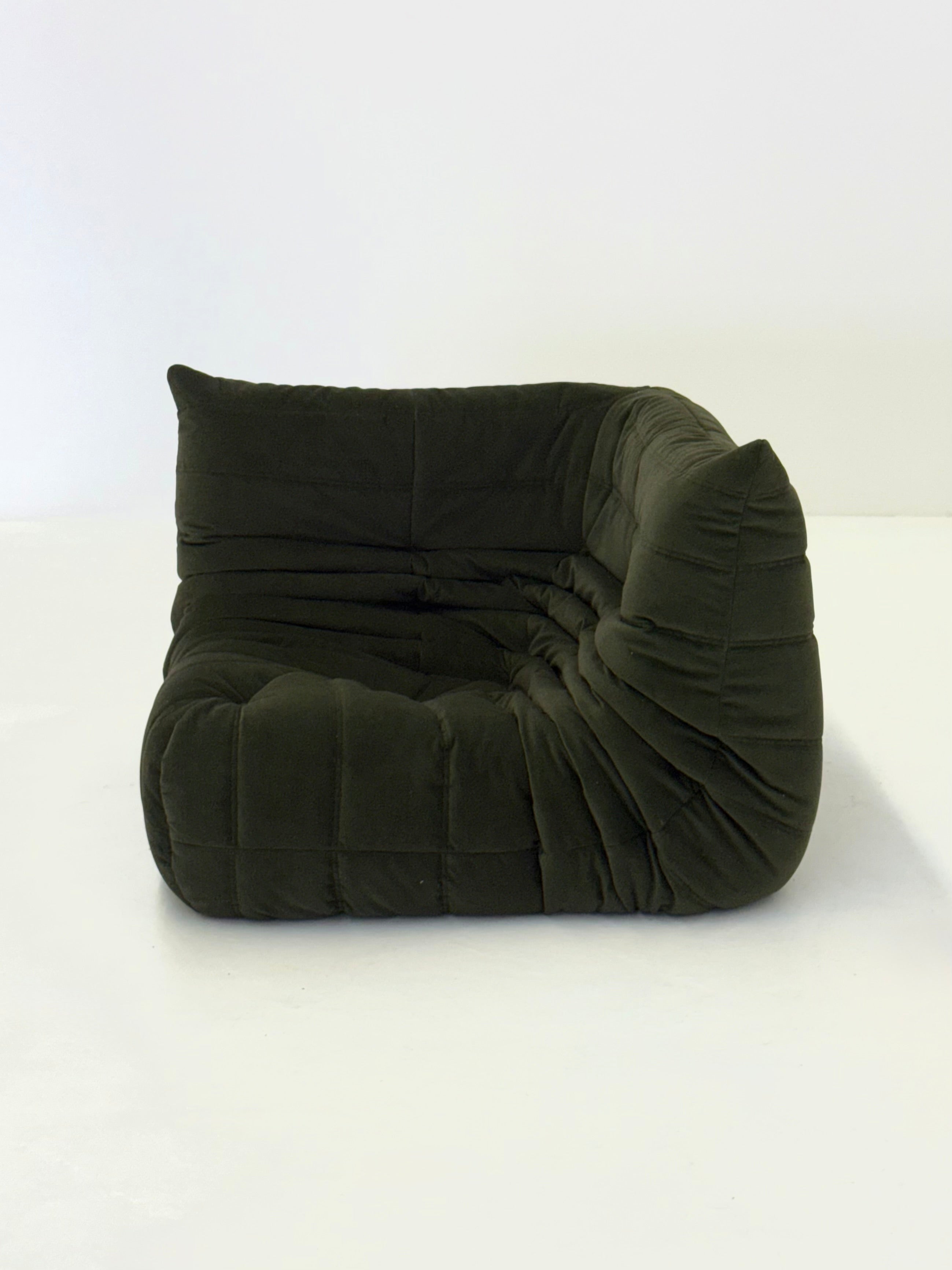 Ligne_Roset_Togo_corner_element_1-seater_in_dark_green_velvet