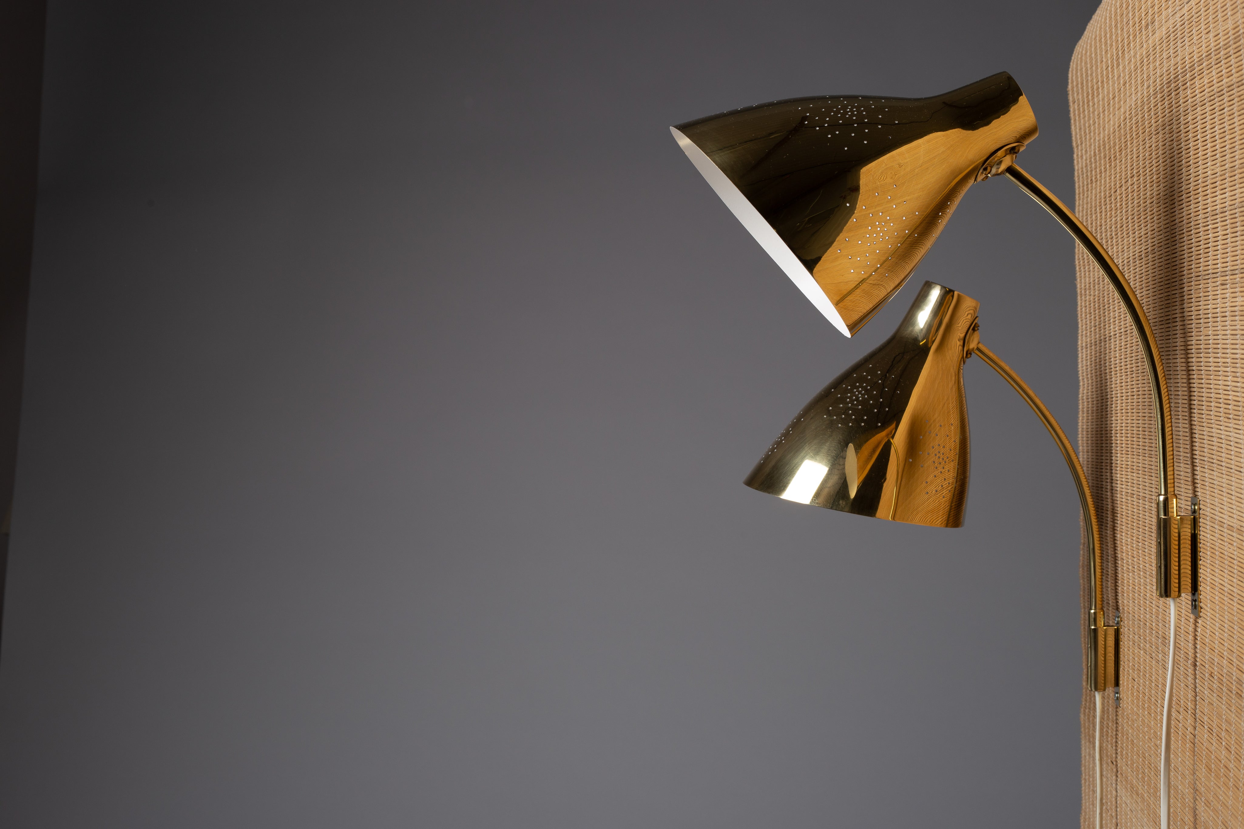 Lisa_Johansson-Pape,_pair_of_1950s_adjustable_brass_wall_sconces_for_ORNO