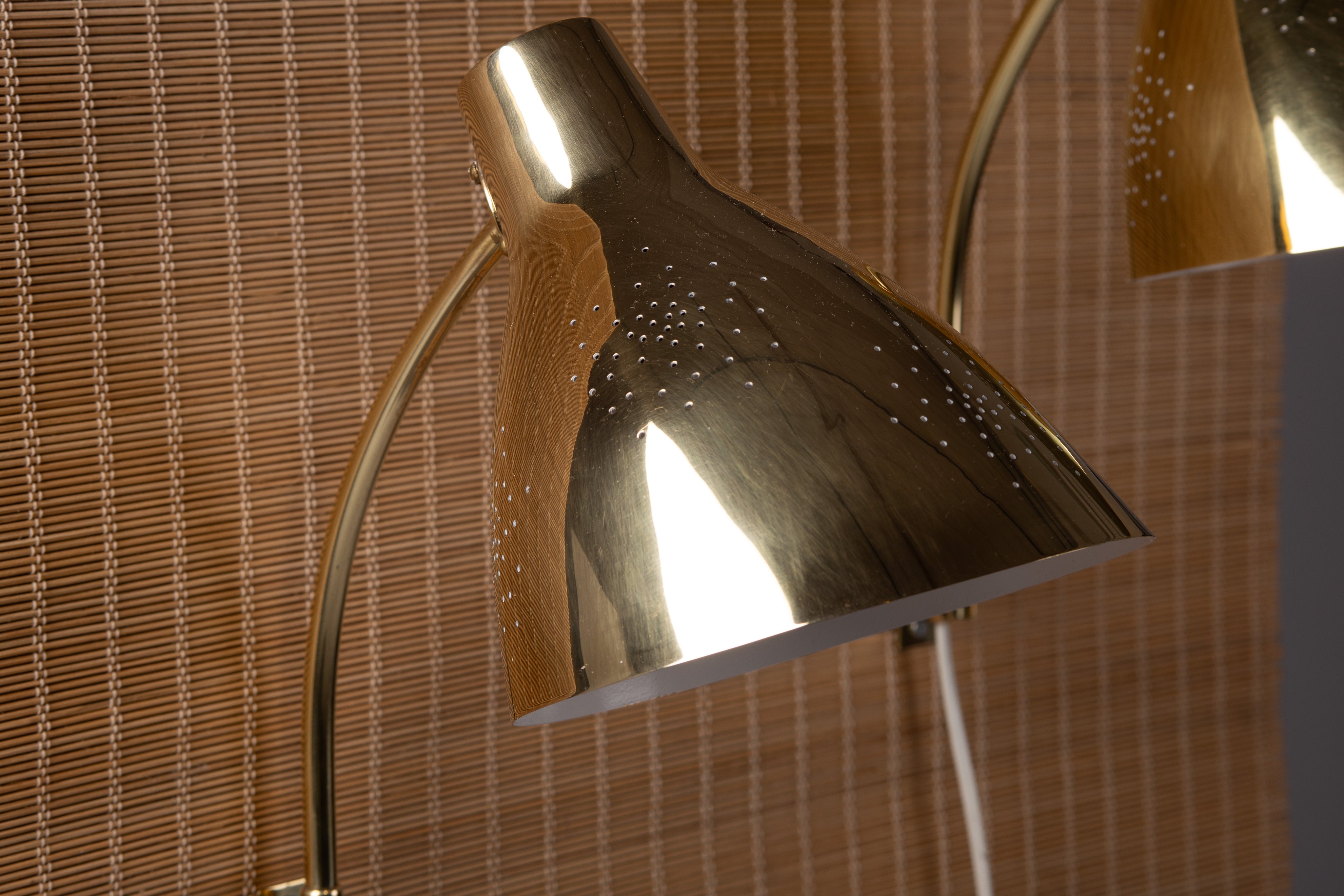 Lisa_Johansson-Pape,_pair_of_1950s_adjustable_brass_wall_sconces_for_ORNO