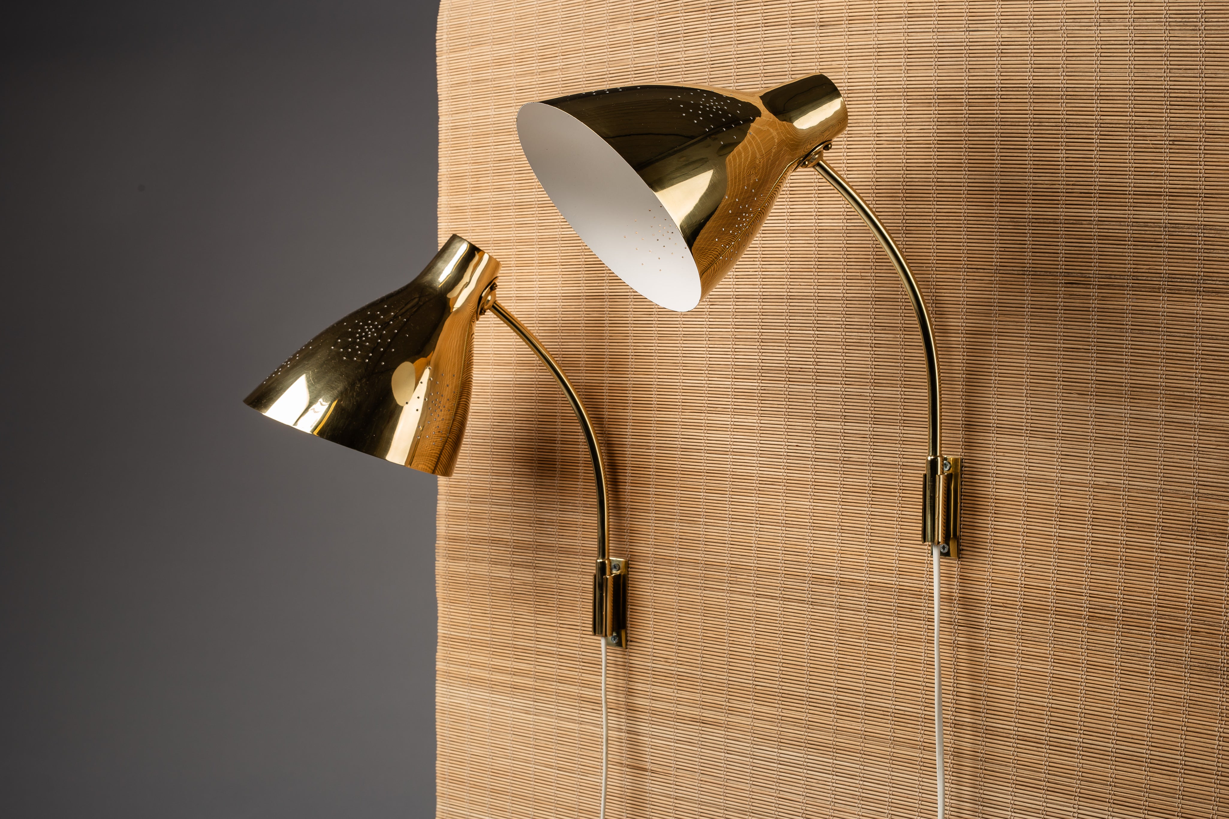 Lisa_Johansson-Pape,_pair_of_1950s_adjustable_brass_wall_sconces_for_ORNO