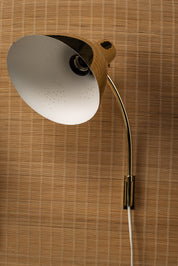 Lisa_Johansson-Pape,_pair_of_1950s_adjustable_brass_wall_sconces_for_ORNO