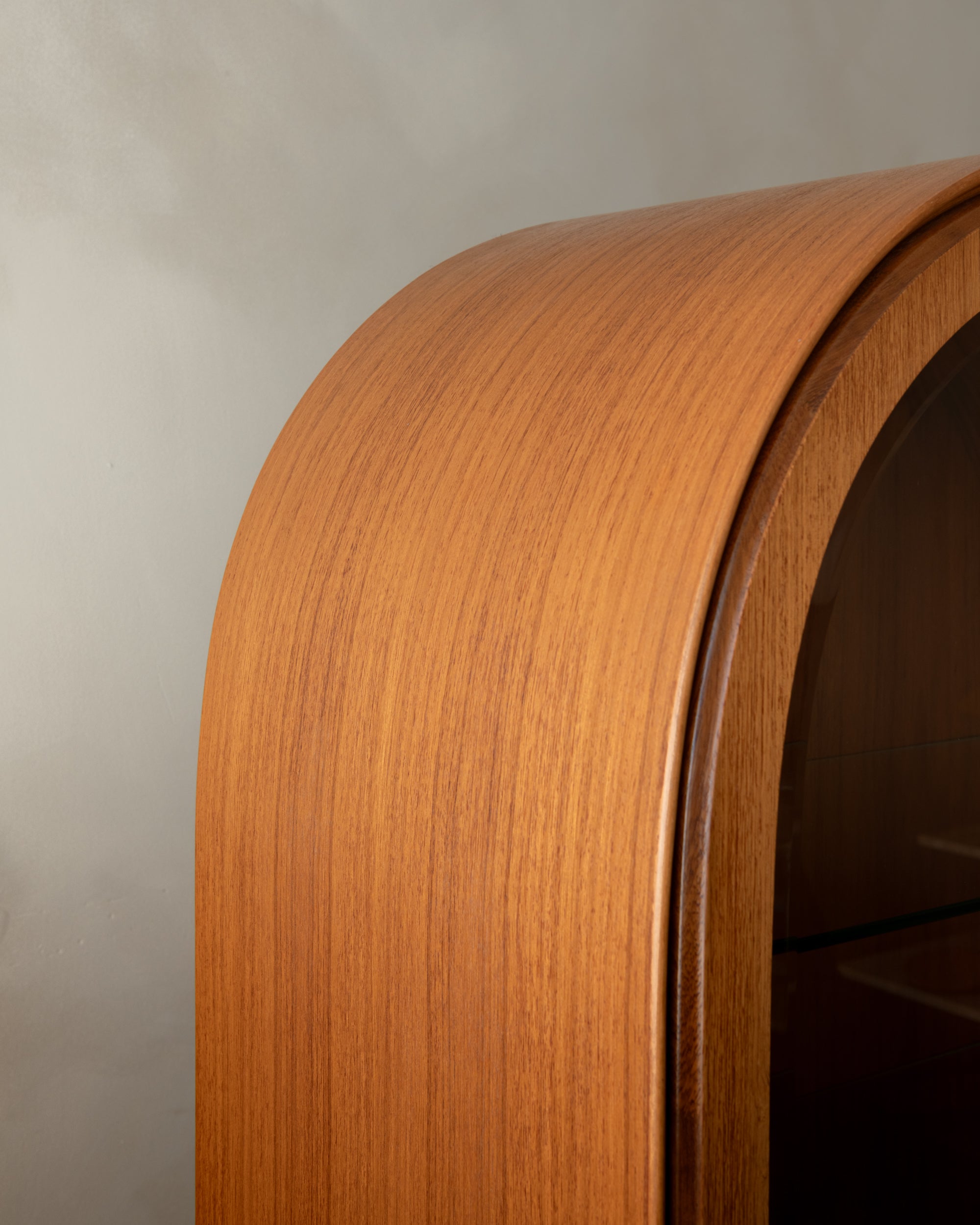 Arched_Teak_and_Glass_Display_Cabinet_with_Integrated_Lighting_by_Brinkmann,_Germany,_1980s