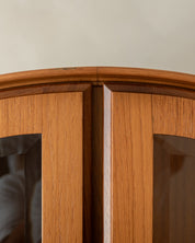 Arched_Teak_and_Glass_Display_Cabinet_with_Integrated_Lighting_by_Brinkmann,_Germany,_1980s