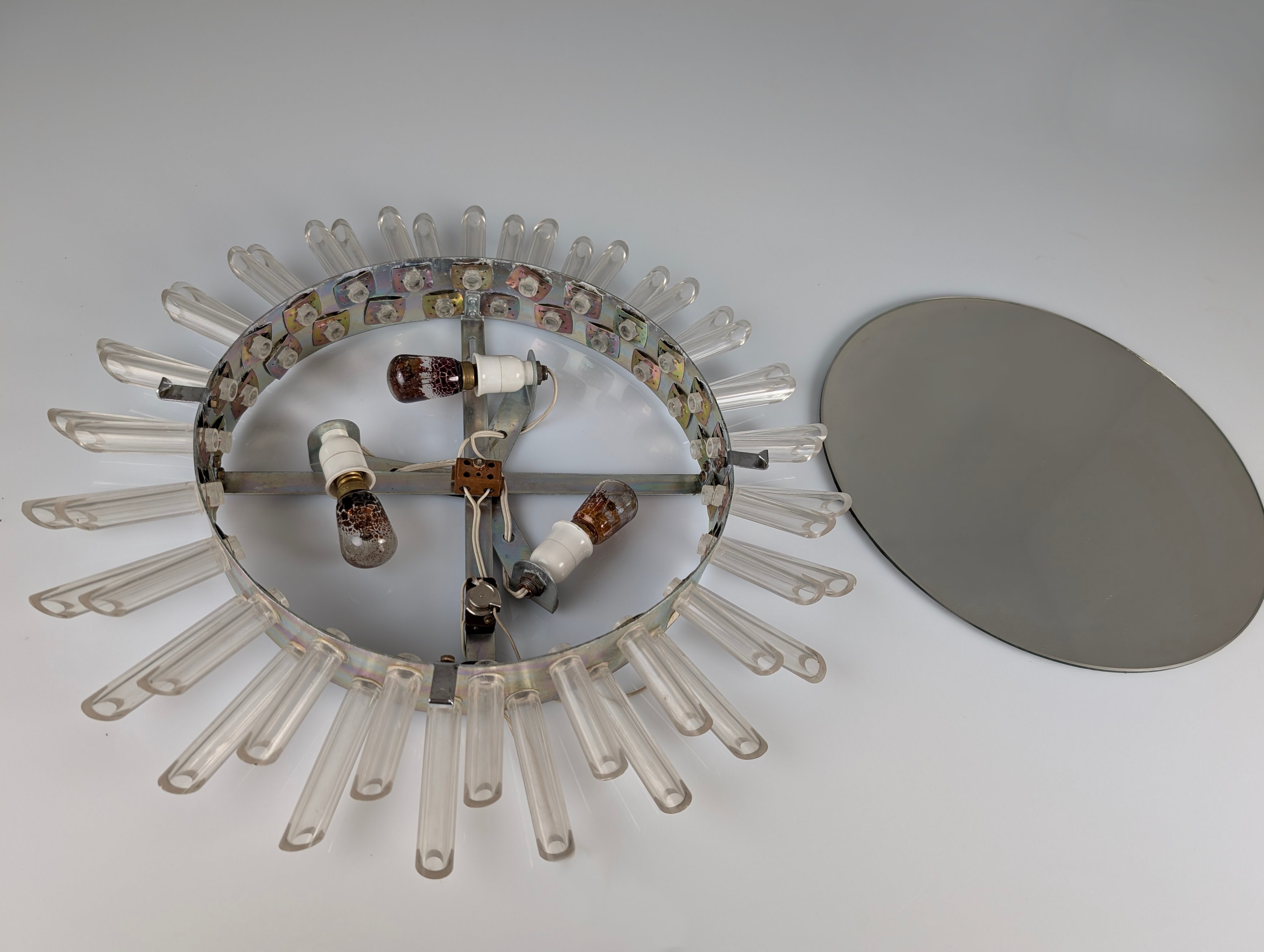 Mid-Century_Modern_Sunburst_Mirror_Wall_Lamp_in_Lucite_with_Pink_Glow,_1970s