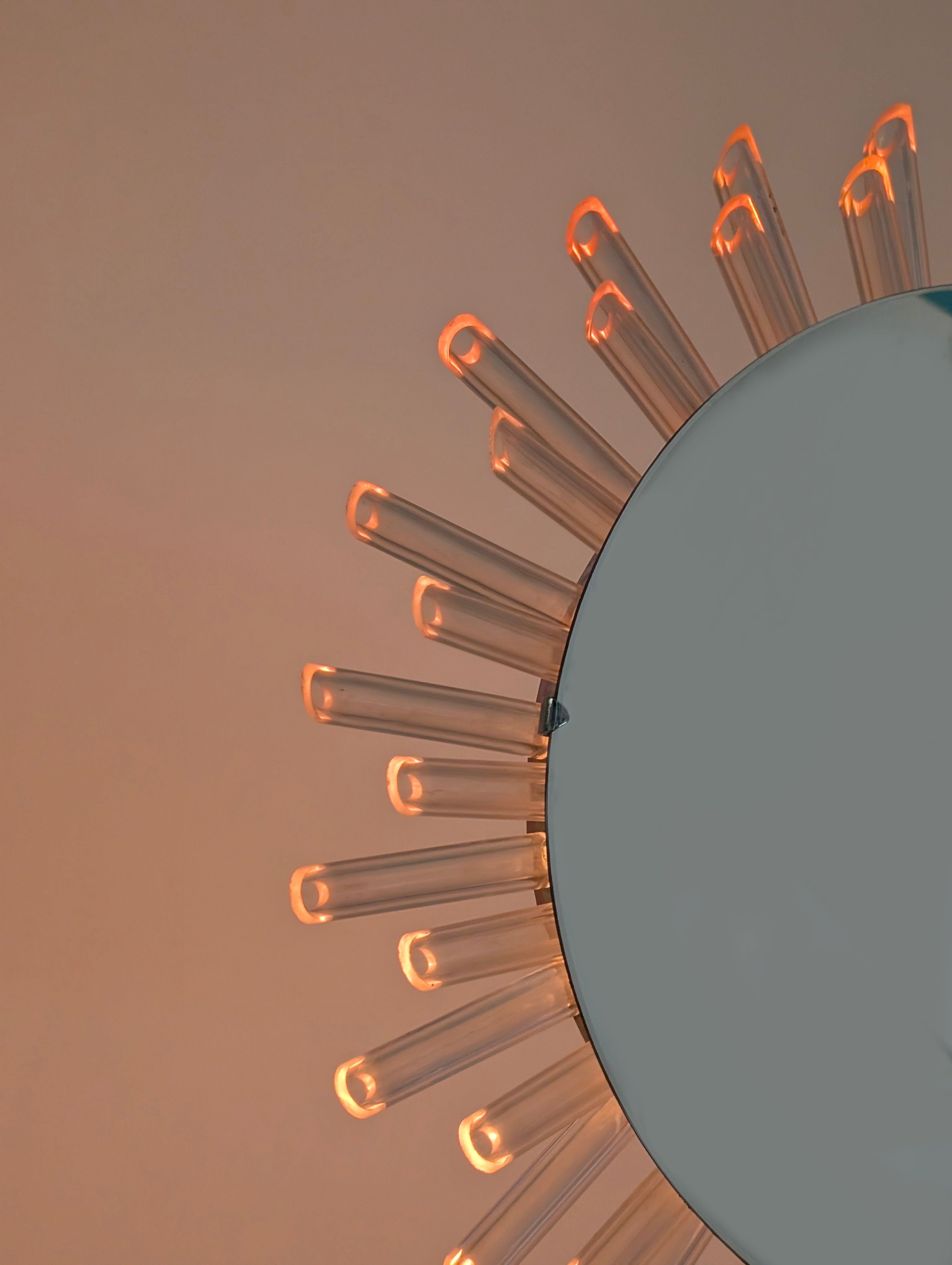 Mid-Century_Modern_Sunburst_Mirror_Wall_Lamp_in_Lucite_with_Pink_Glow,_1970s