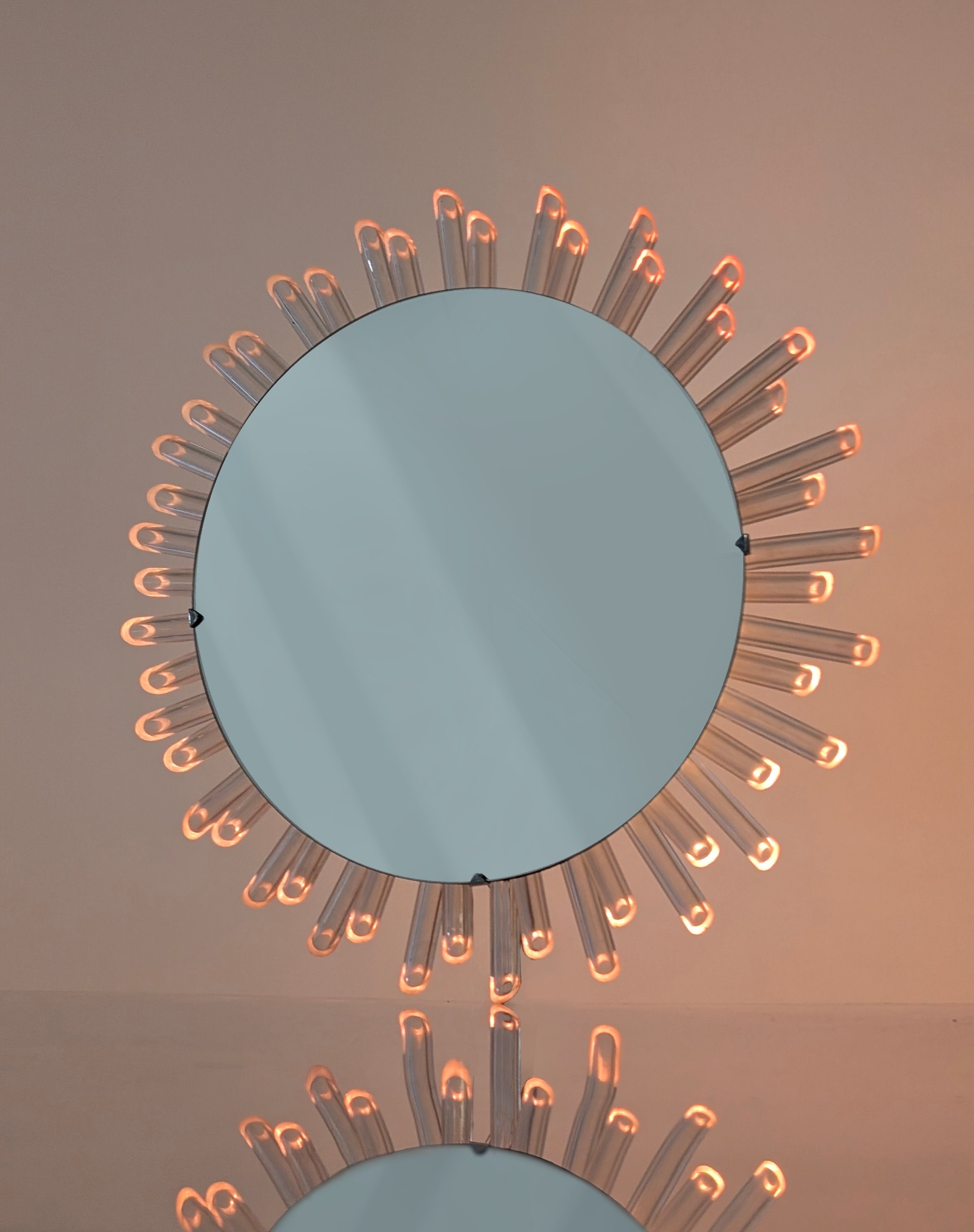 Mid-Century_Modern_Sunburst_Mirror_Wall_Lamp_in_Lucite_with_Pink_Glow,_1970s