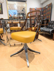 Set_of_4_Grafton_Atomic_Swivel_Chairs_in_Amber_Lucite_and_Mustard_Leather