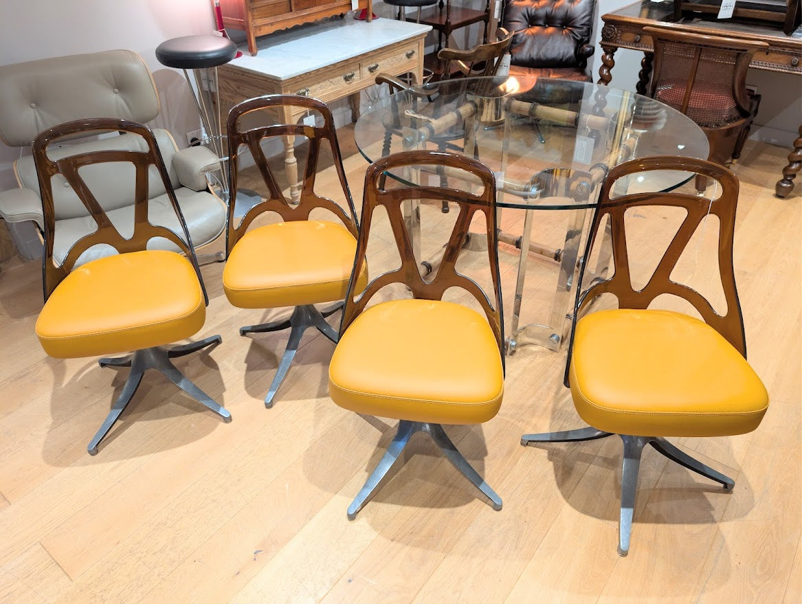 Set_of_4_Grafton_Atomic_Swivel_Chairs_in_Amber_Lucite_and_Mustard_Leather