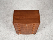 Midcentury_Danish_chest_in_teak_1960s,_bowed_front_with_half_moon_drawer_handles
