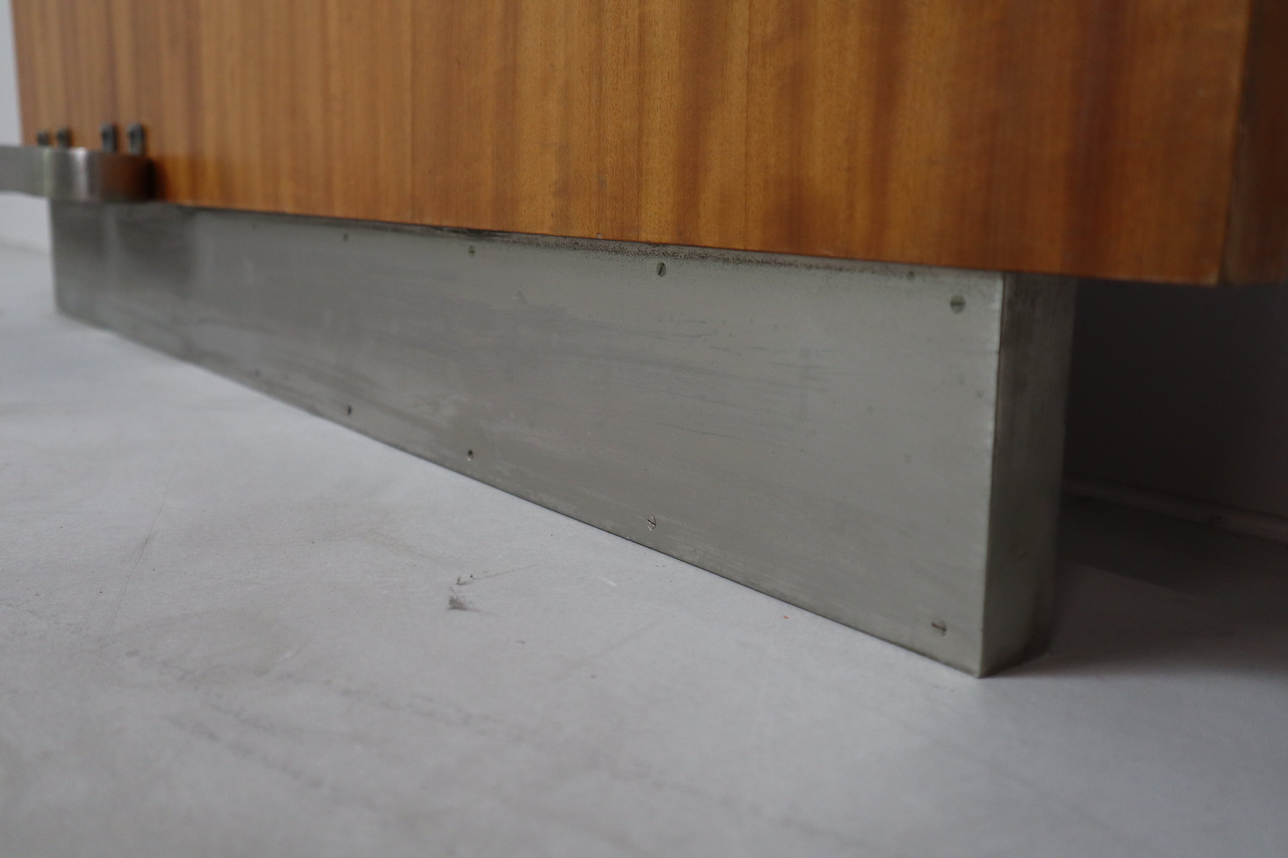 Modernist_wall-mounted_cloakroom_in_Teak,_Aluminium_&_Nickel-plated_Brass,_1950s