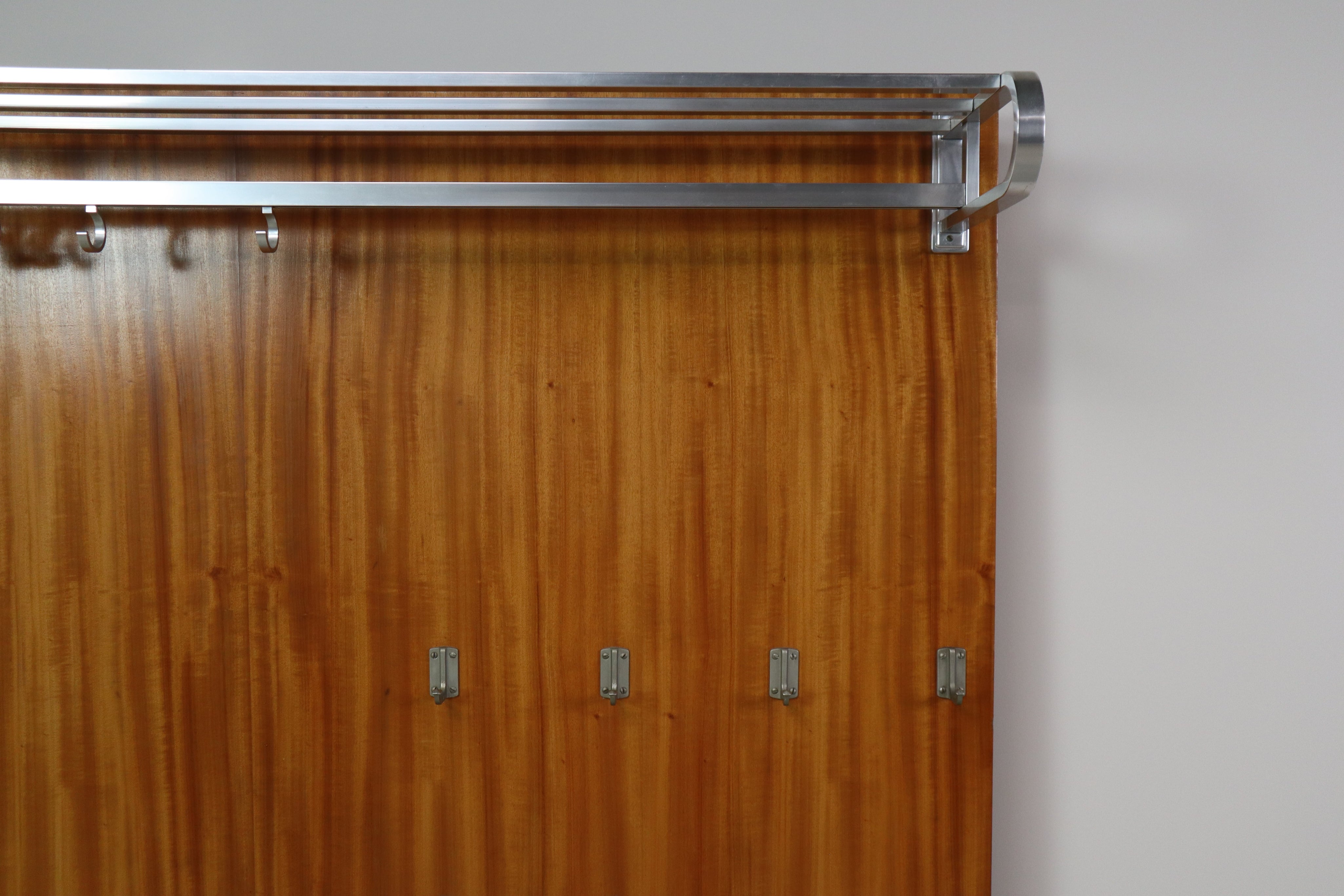 Modernist_wall-mounted_cloakroom_in_Teak,_Aluminium_&_Nickel-plated_Brass,_1950s