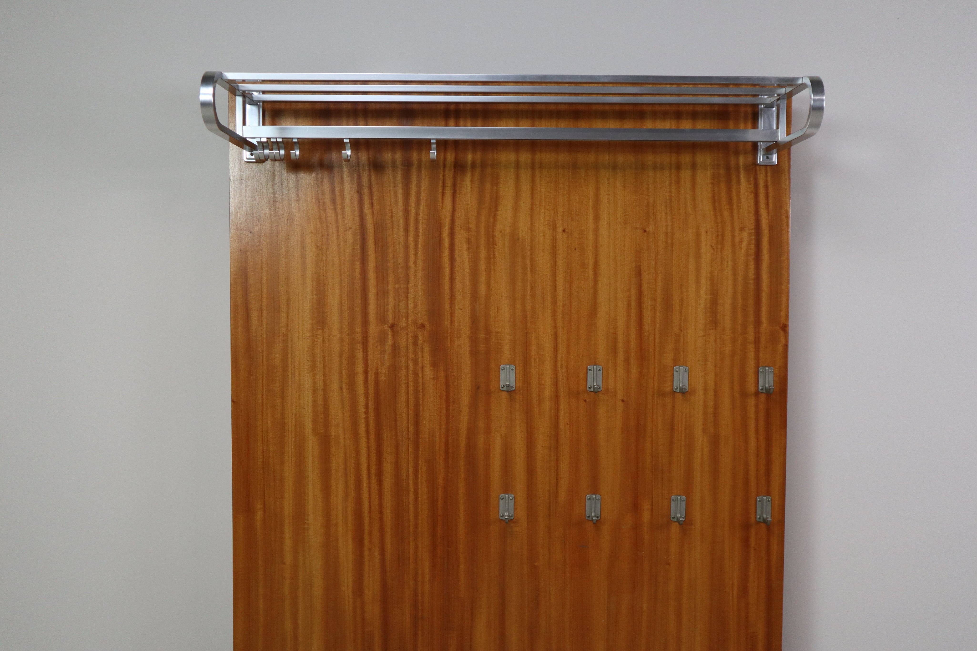 Modernist_wall-mounted_cloakroom_in_Teak,_Aluminium_&_Nickel-plated_Brass,_1950s