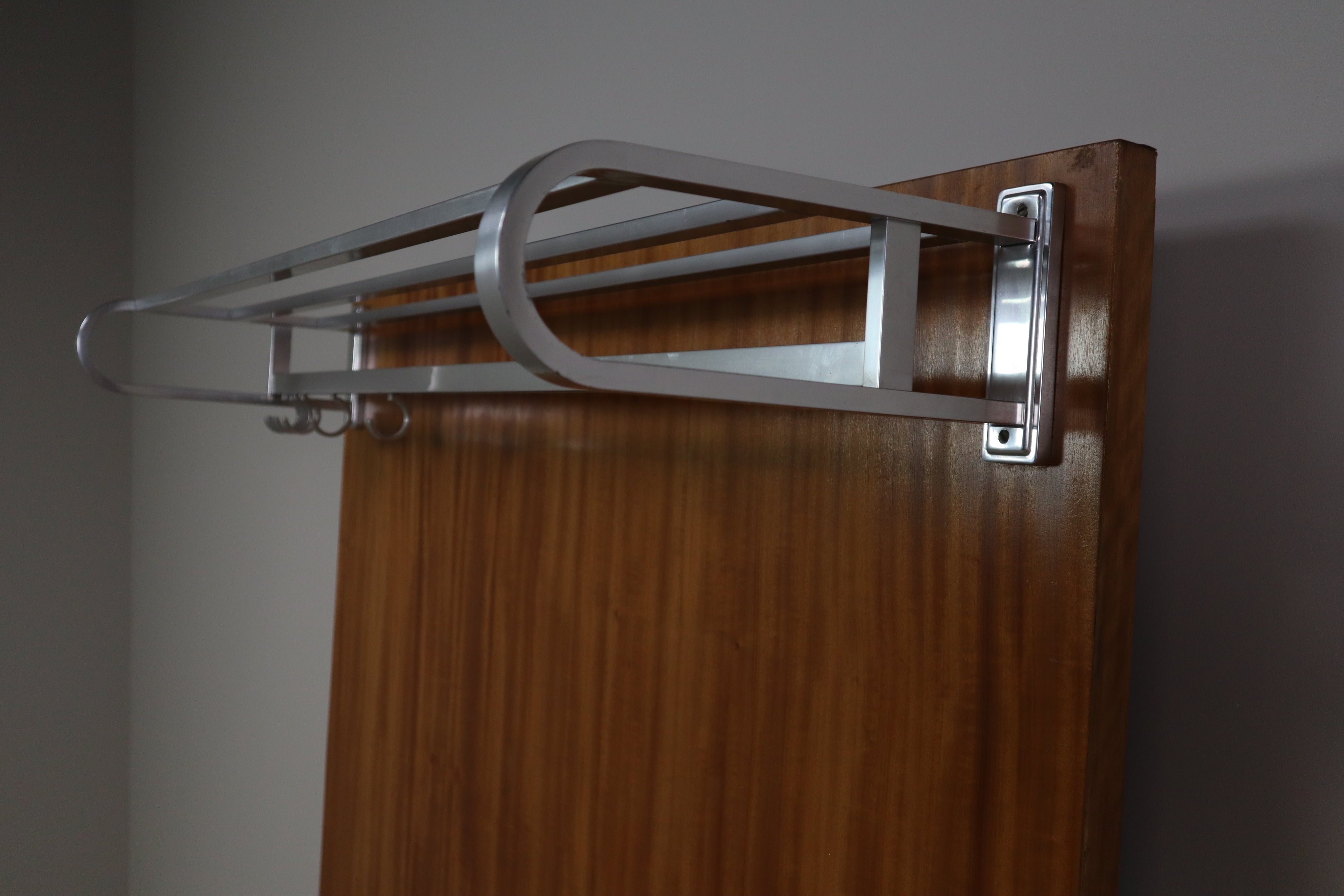 Modernist_wall-mounted_cloakroom_in_Teak,_Aluminium_&_Nickel-plated_Brass,_1950s