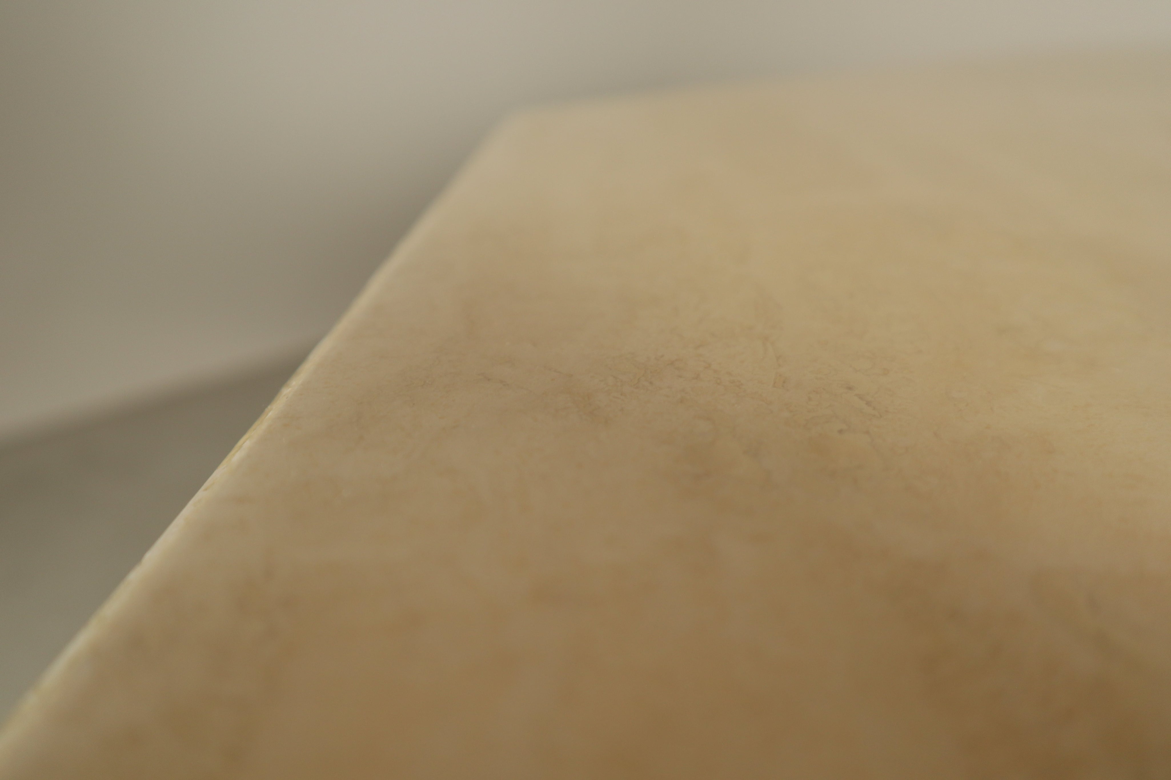 Octagonal_travertine_dining_table,_1970s