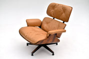 Eames_Lounge_Chair_and_Ottoman_by_Charles_&_Ray_Eames_for_Herman_Miller,_Rosewood_&_Butterscotch_Leather,_1960s