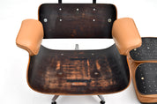 Eames_Lounge_Chair_and_Ottoman_by_Charles_&_Ray_Eames_for_Herman_Miller,_Rosewood_&_Butterscotch_Leather,_1960s