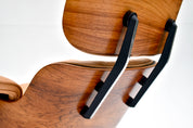 Eames_Lounge_Chair_and_Ottoman_by_Charles_&_Ray_Eames_for_Herman_Miller,_Rosewood_&_Butterscotch_Leather,_1960s