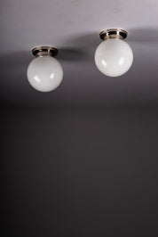 Set_of_2_Paavo_Tynell_Opaline_Glass_Sphere_Flush_Mount_Lamps,_1930s