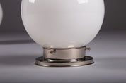Set_of_2_Paavo_Tynell_Opaline_Glass_Sphere_Flush_Mount_Lamps,_1930s