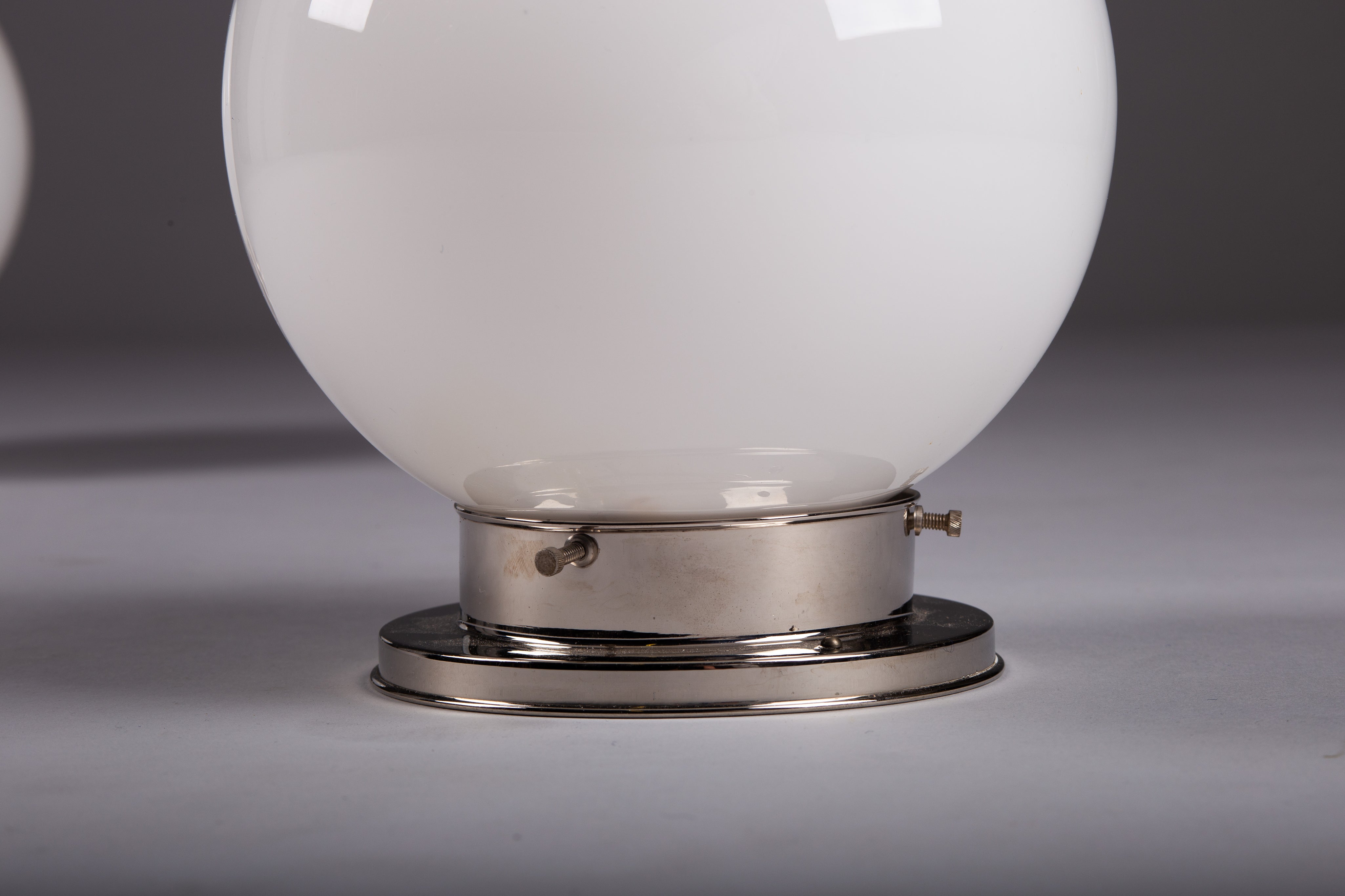 Set_of_2_Paavo_Tynell_Opaline_Glass_Sphere_Flush_Mount_Lamps,_1930s