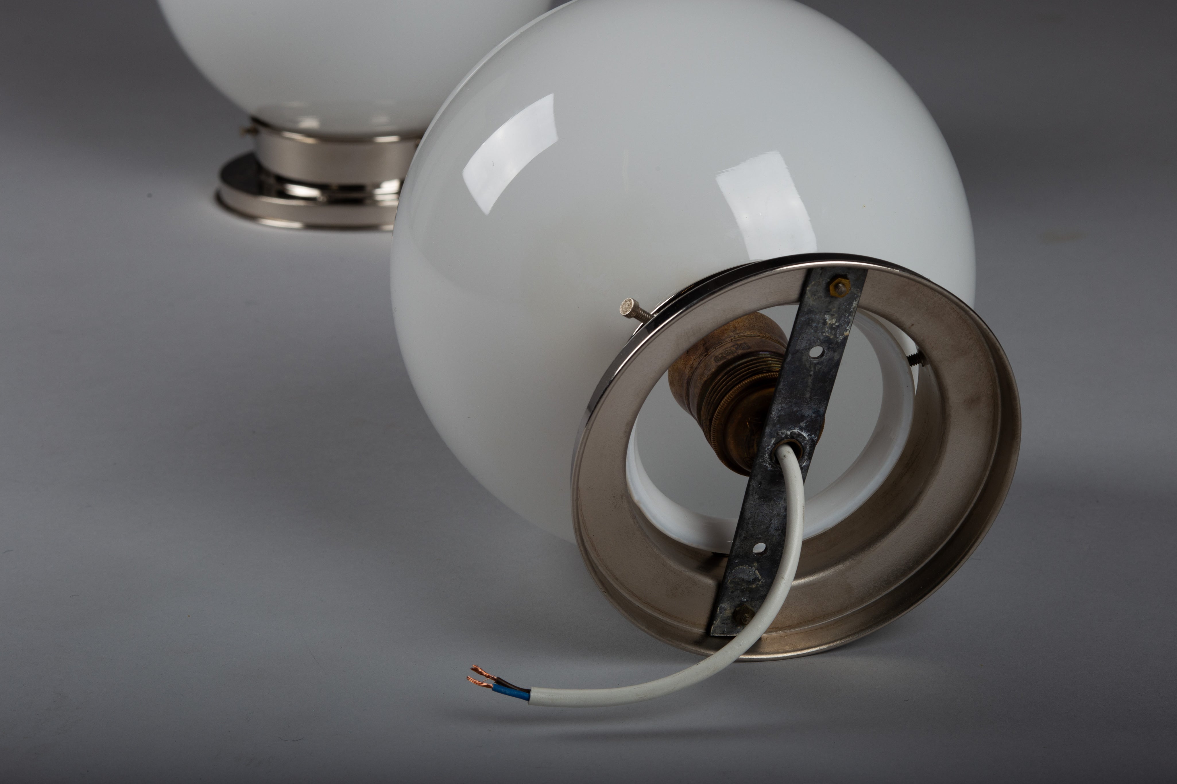 Set_of_2_Paavo_Tynell_Opaline_Glass_Sphere_Flush_Mount_Lamps,_1930s