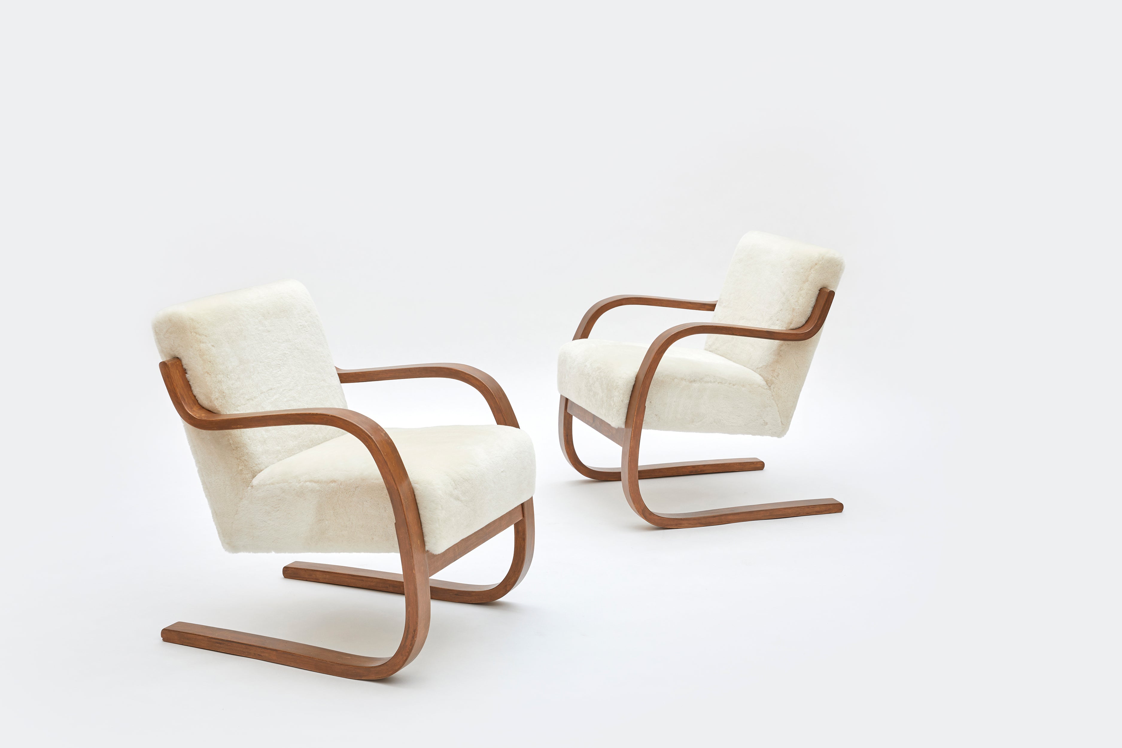 Set_of_2_Alvar_Aalto_Model_402_Armchairs_in_Shearling_and_Birch