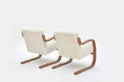 Set_of_2_Alvar_Aalto_Model_402_Armchairs_in_Shearling_and_Birch