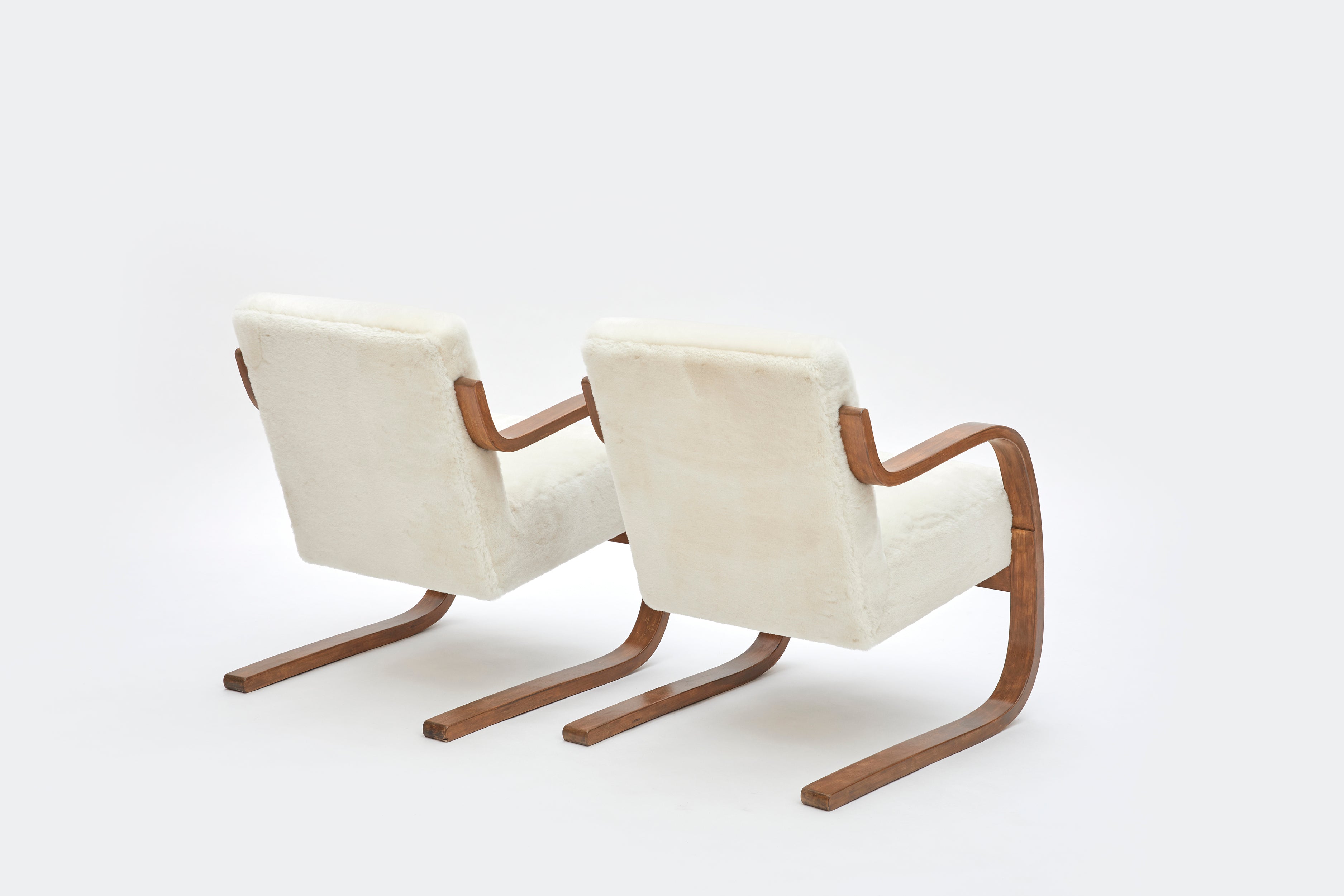 Set_of_2_Alvar_Aalto_Model_402_Armchairs_in_Shearling_and_Birch