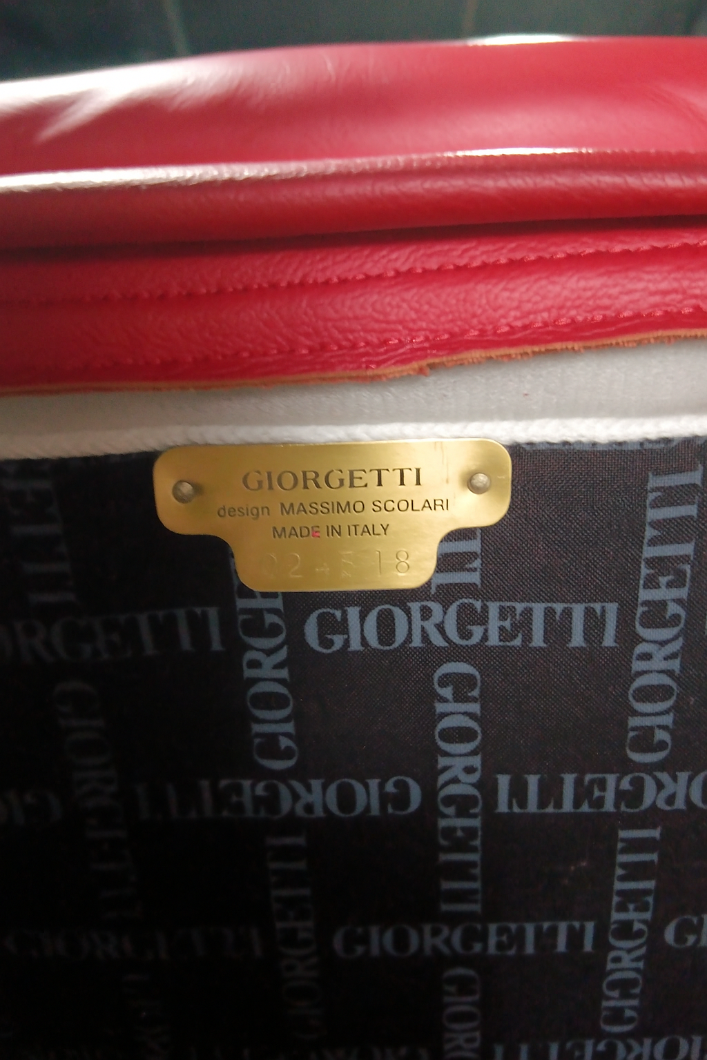 Set_of_2_Giorgetti_Progretti_armchairs_in_red_leather,_custom_edition_by_Massimo_Scolari