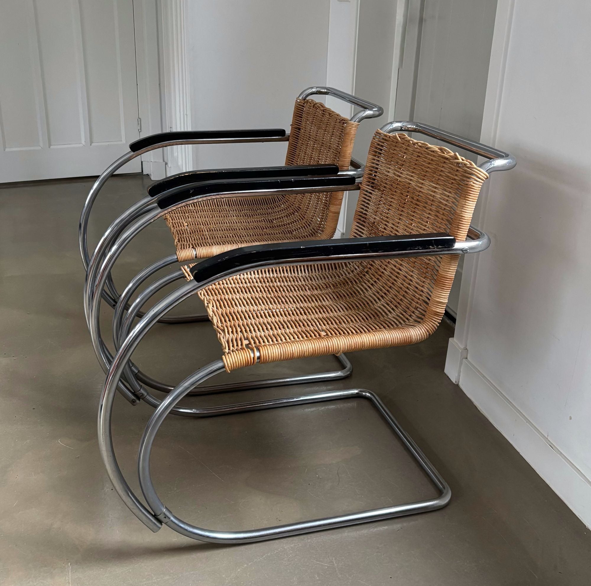Set_of_2_Bauhaus_Rattan_and_Chrome_Tubular_Steel_Lounge_Chairs,_in_the_Style_of_Ludwig_Mies_van_der_Rohe