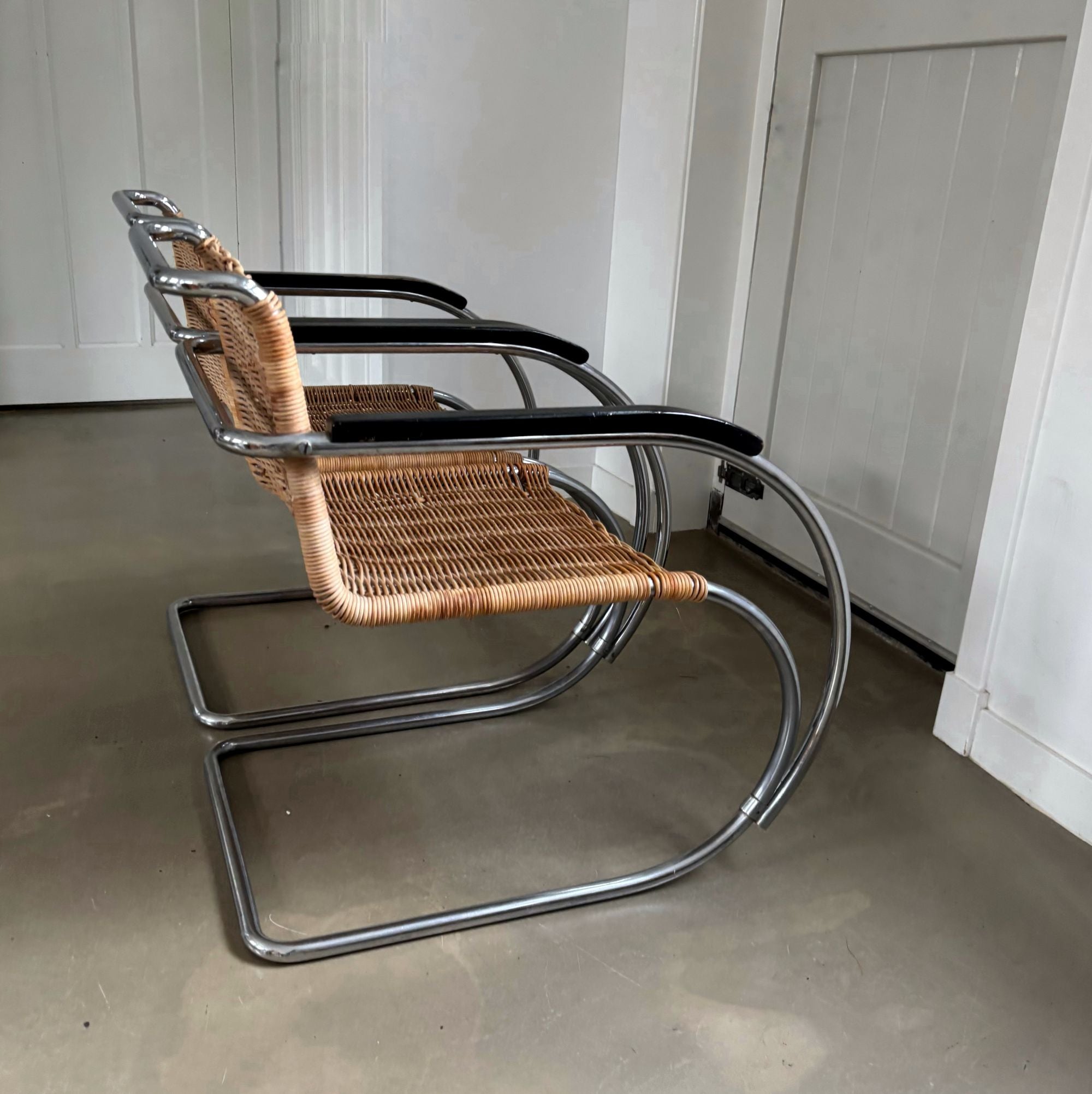 Set_of_2_Bauhaus_Rattan_and_Chrome_Tubular_Steel_Lounge_Chairs,_in_the_Style_of_Ludwig_Mies_van_der_Rohe