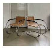 Set_of_2_Bauhaus_Rattan_and_Chrome_Tubular_Steel_Lounge_Chairs,_in_the_Style_of_Ludwig_Mies_van_der_Rohe