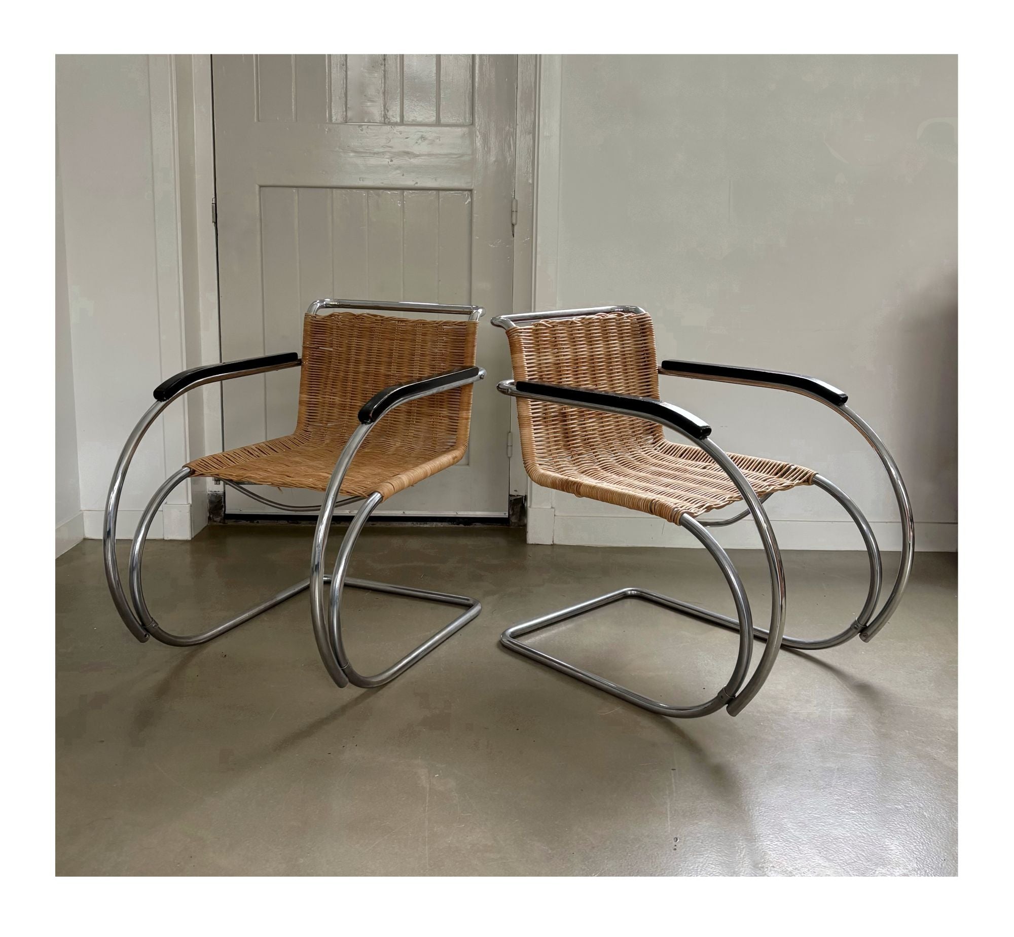 Set_of_2_Bauhaus_Rattan_and_Chrome_Tubular_Steel_Lounge_Chairs,_in_the_Style_of_Ludwig_Mies_van_der_Rohe