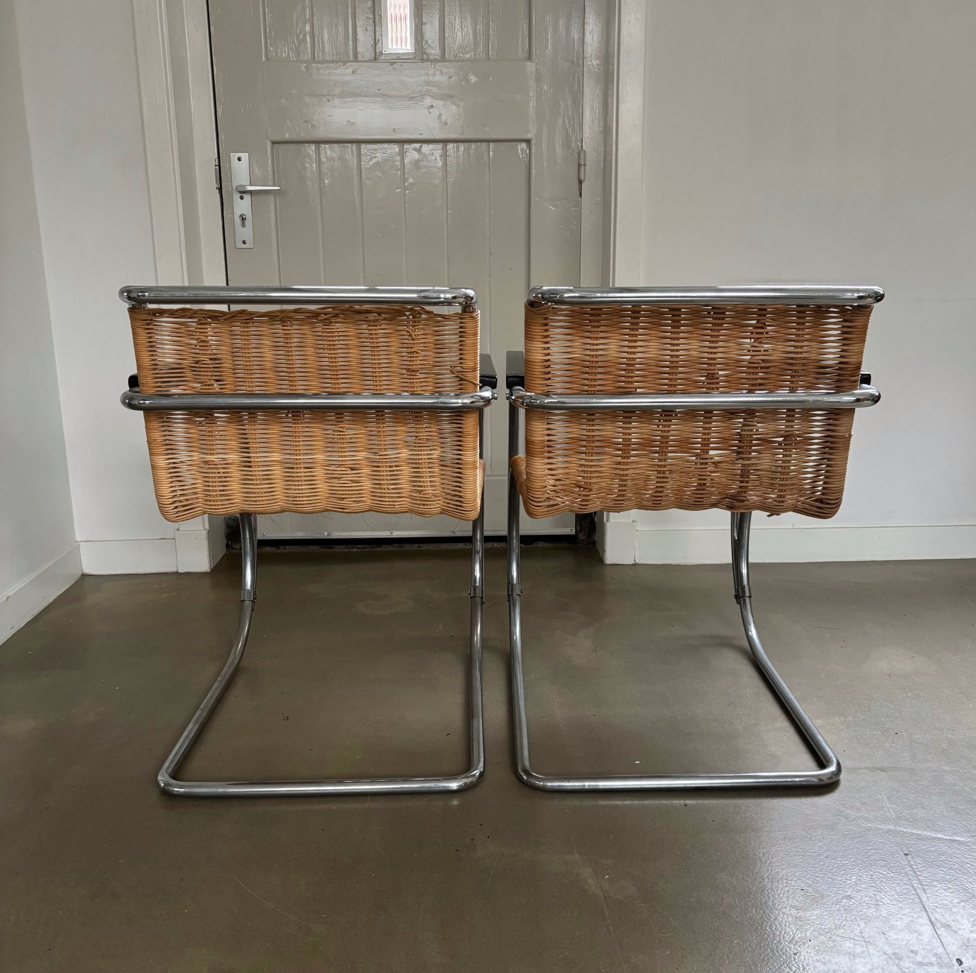 Set_of_2_Bauhaus_Rattan_and_Chrome_Tubular_Steel_Lounge_Chairs,_in_the_Style_of_Ludwig_Mies_van_der_Rohe