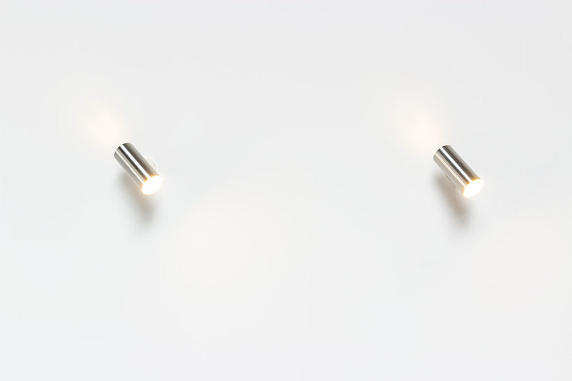 Set_of_2_Raak_modernist_brushed_metal_cylinder_sconces_circa_1970