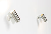 Set_of_2_Raak_modernist_brushed_metal_cylinder_sconces_circa_1970