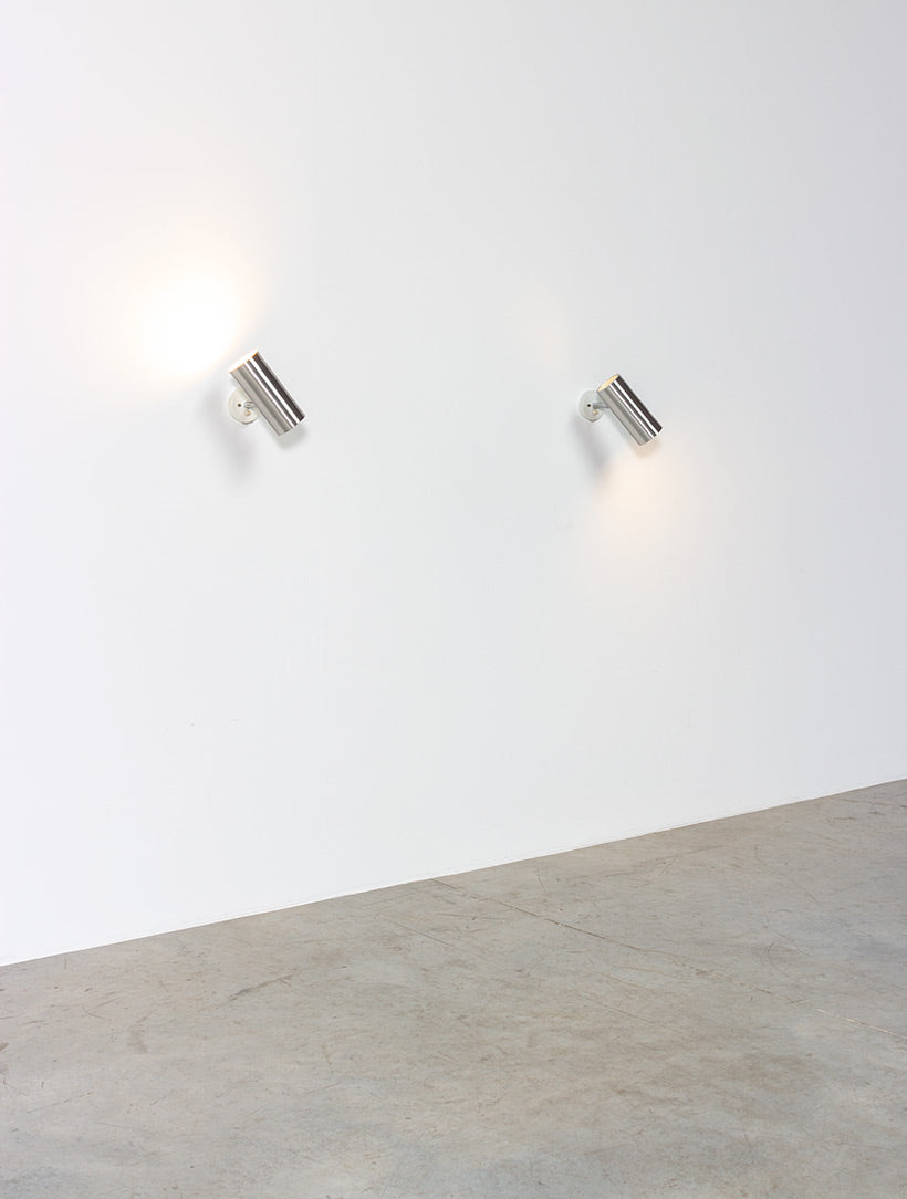 Set_of_2_Raak_modernist_brushed_metal_cylinder_sconces_circa_1970