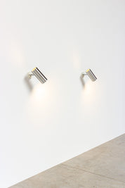 Set_of_2_Raak_modernist_brushed_metal_cylinder_sconces_circa_1970