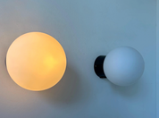 Set_of_2_RAAK_Opaline_and_Bakelite_Wall_Sconces,_Dutch_Mid_Century_Modern_Lighting,_1970s