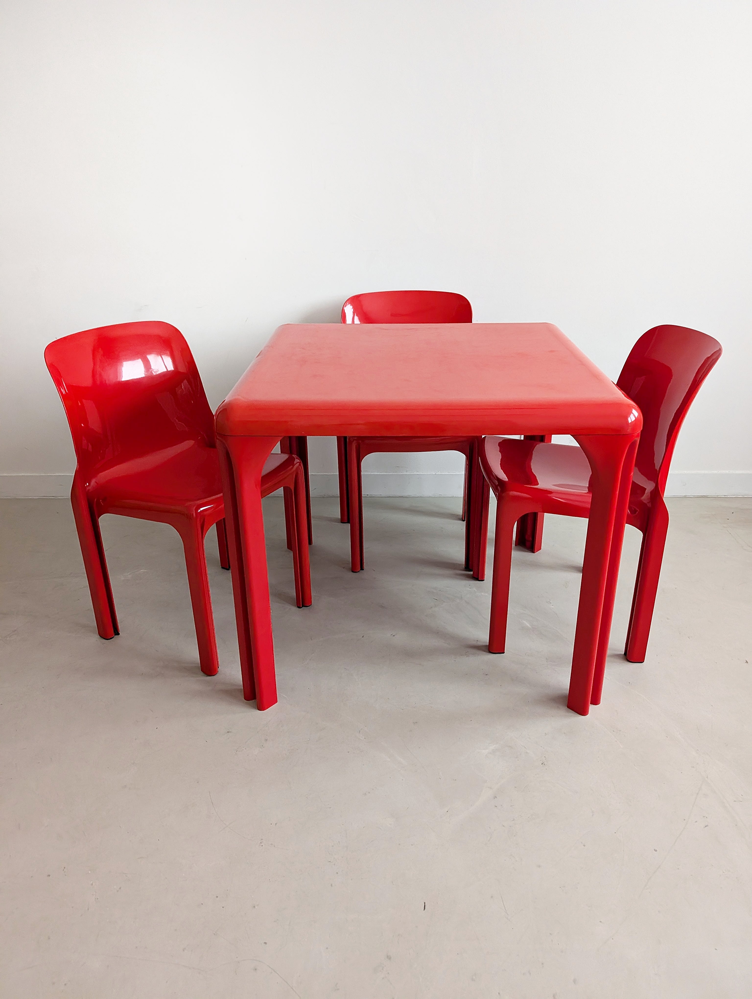 Set_of_Red_Selene_Table_and_3_chairs_by_Vico_Magistretti_for_Artemide,_1960s