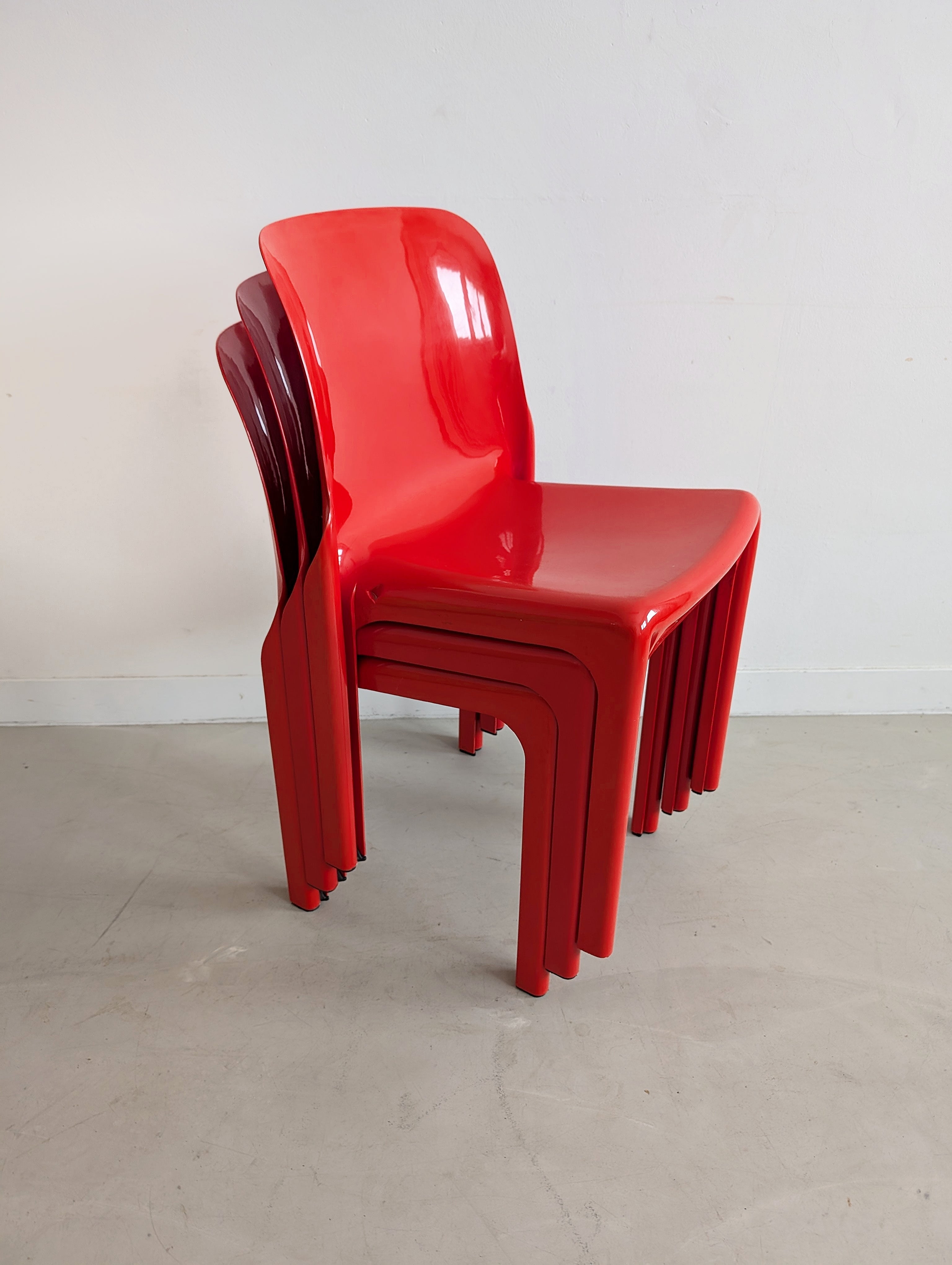 Set_of_Red_Selene_Table_and_3_chairs_by_Vico_Magistretti_for_Artemide,_1960s