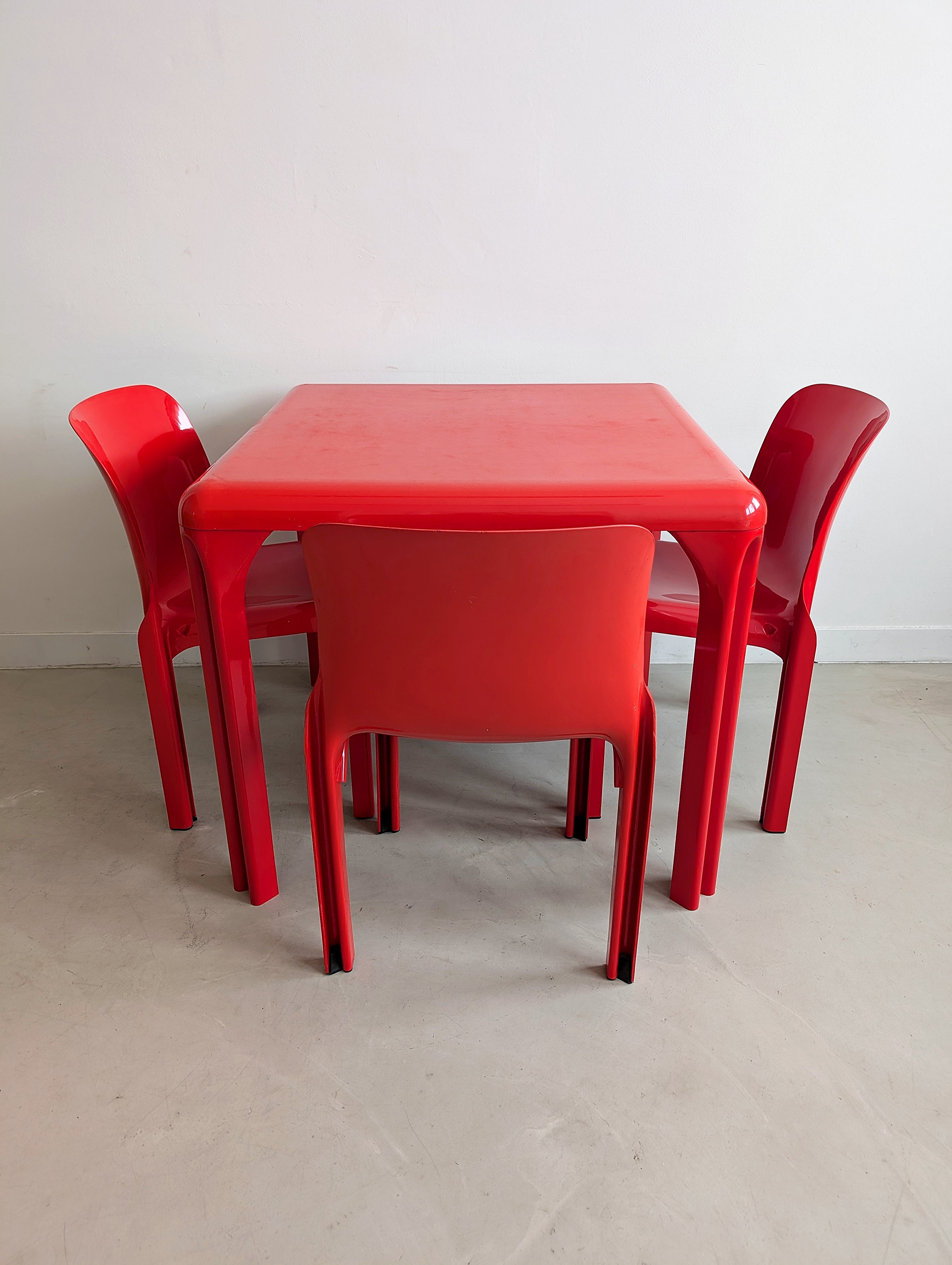 Set_of_Red_Selene_Table_and_3_chairs_by_Vico_Magistretti_for_Artemide,_1960s