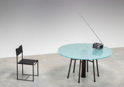 Round_Postmodern_dining_table_featuring_a_geometric_base_1980