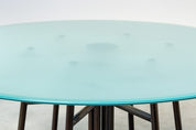 Round_Postmodern_dining_table_featuring_a_geometric_base_1980