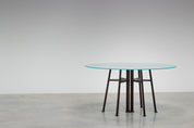 Round_Postmodern_dining_table_featuring_a_geometric_base_1980