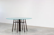 Round_Postmodern_dining_table_featuring_a_geometric_base_1980