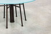 Round_Postmodern_dining_table_featuring_a_geometric_base_1980