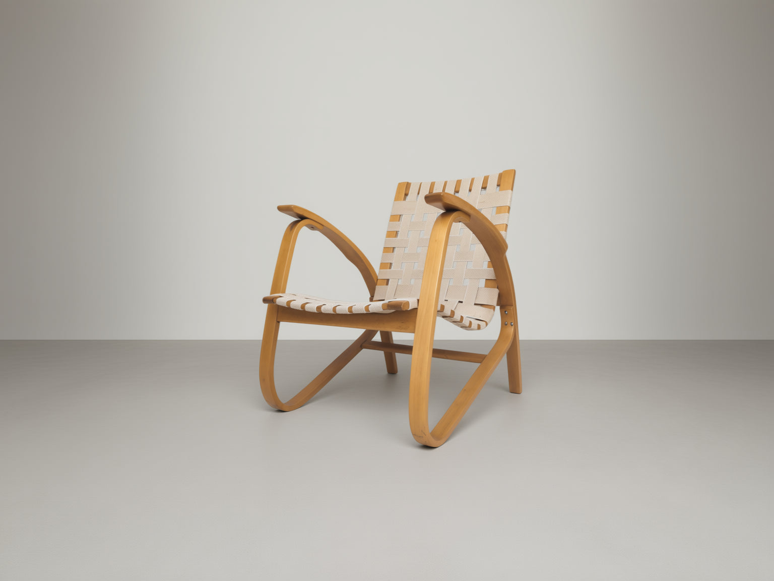 Functionalist_Bentwood_Lounge_Chair_by_Jan_Vaněk_with_Ivory_Woven_Straps,_Czechoslovakia,_1930s