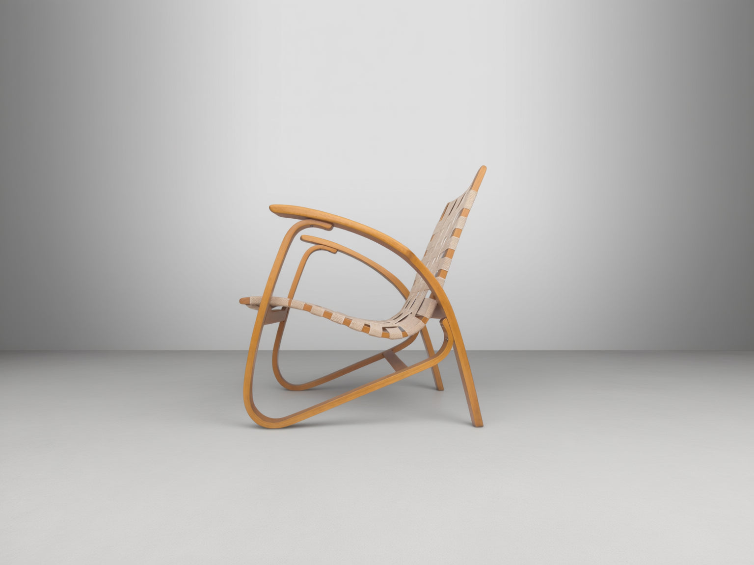 Functionalist_Bentwood_Lounge_Chair_by_Jan_Vaněk_with_Ivory_Woven_Straps,_Czechoslovakia,_1930s