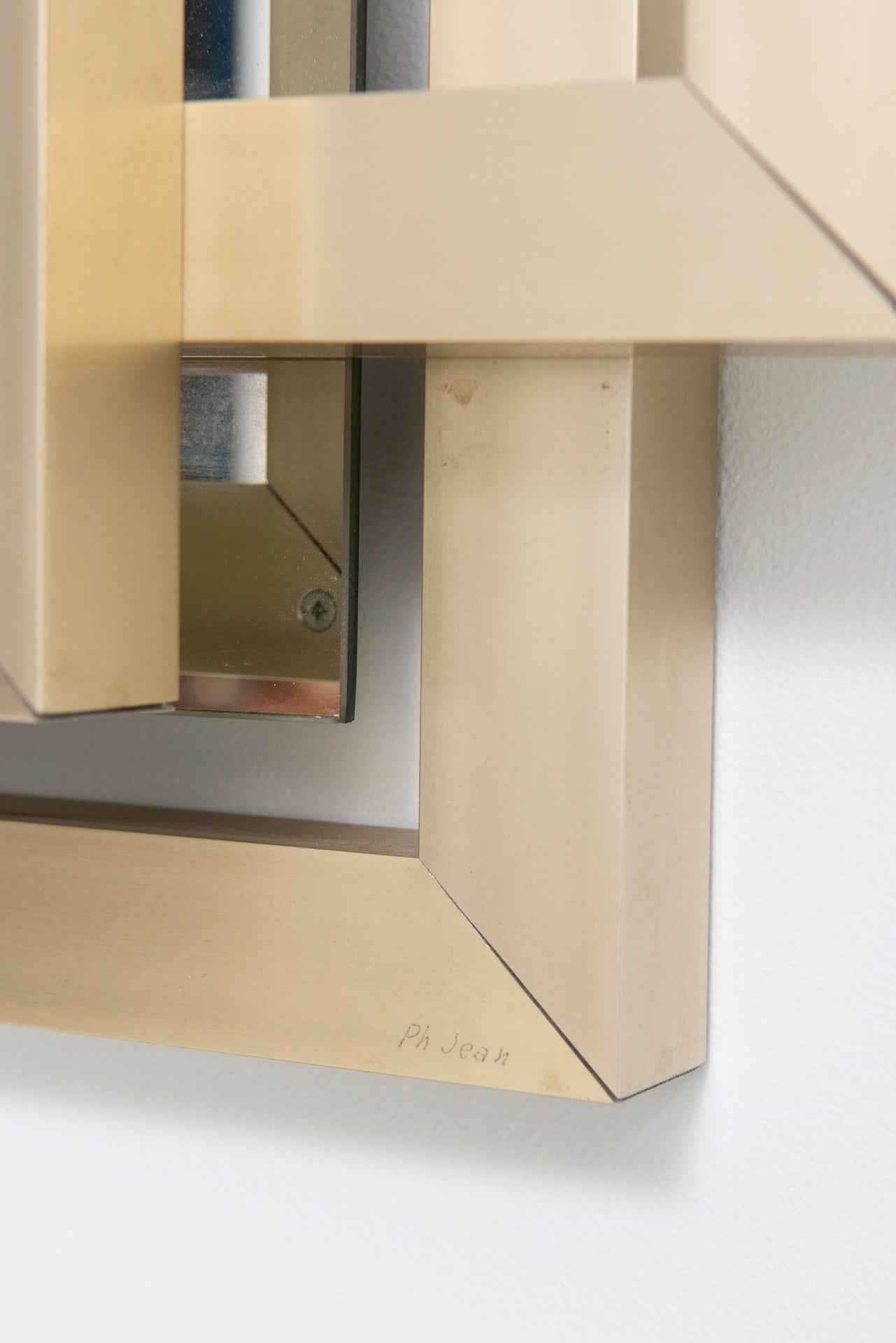 Sculptural_mirror_in_brass,_1970s_by_Philippe_Jean